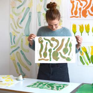 Anna Šebestová holding up prints